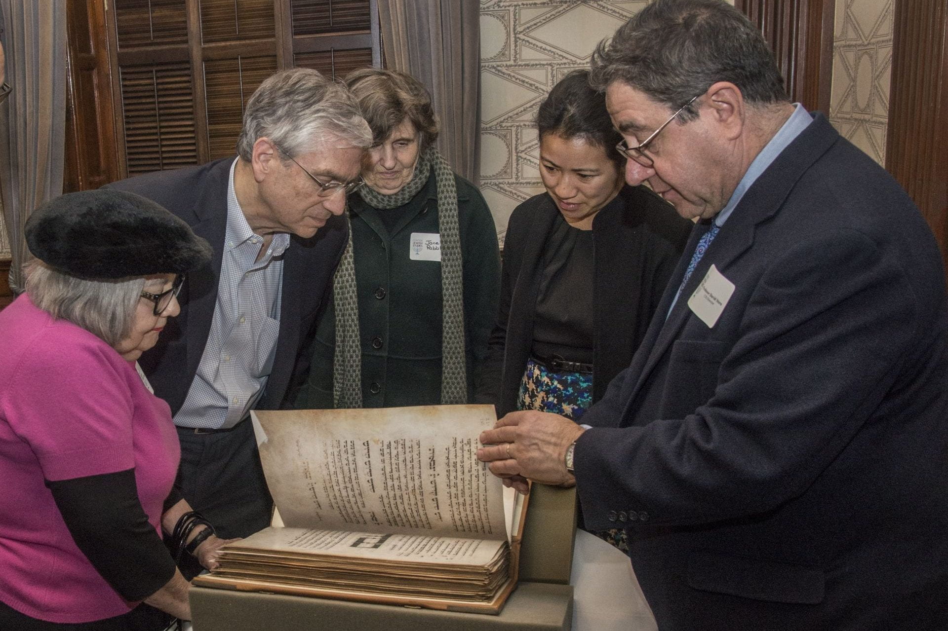 David Stern showing old manuscript to CJS donors Event